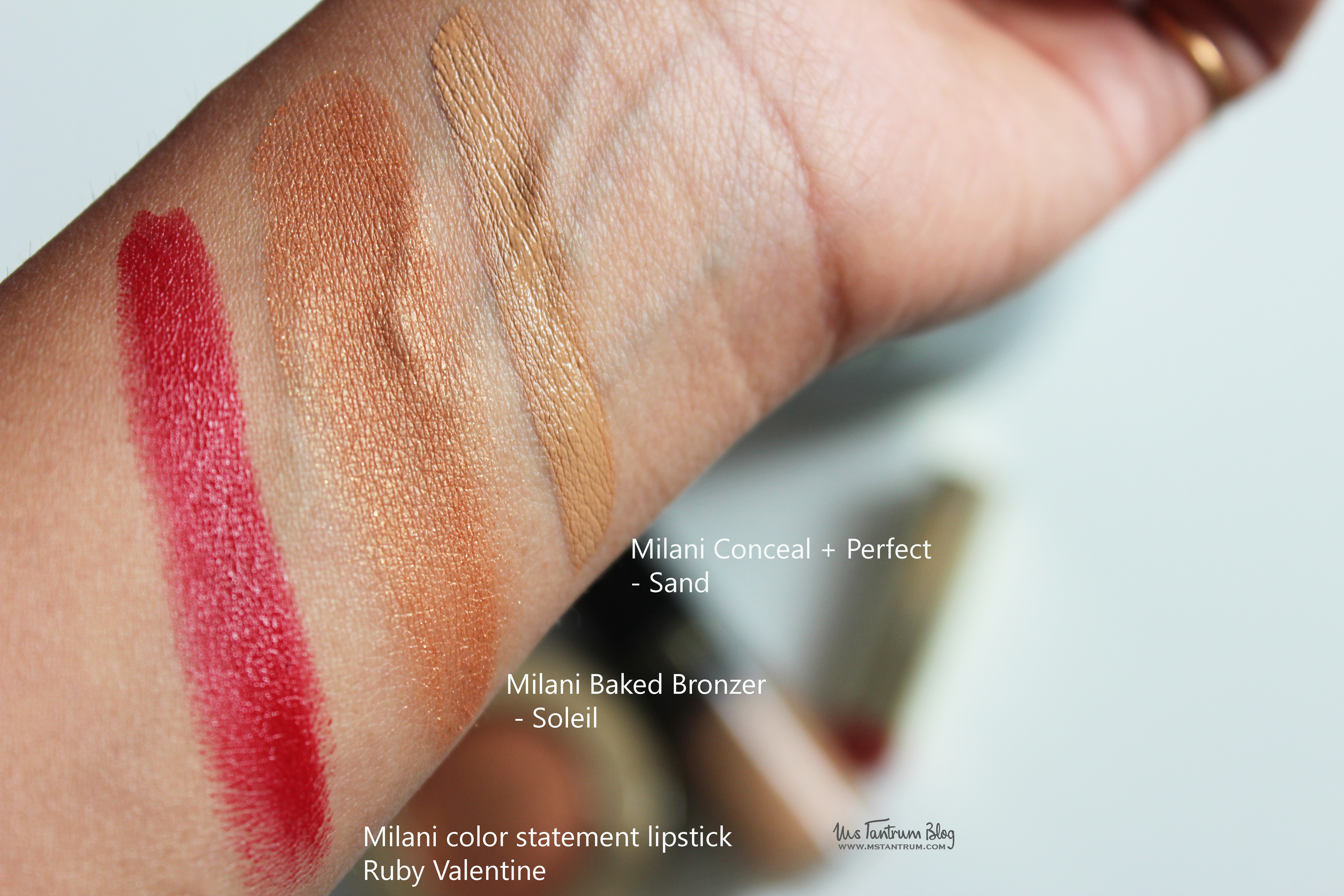 Milani foundation swatch, milani bronzer and lipstick swatches